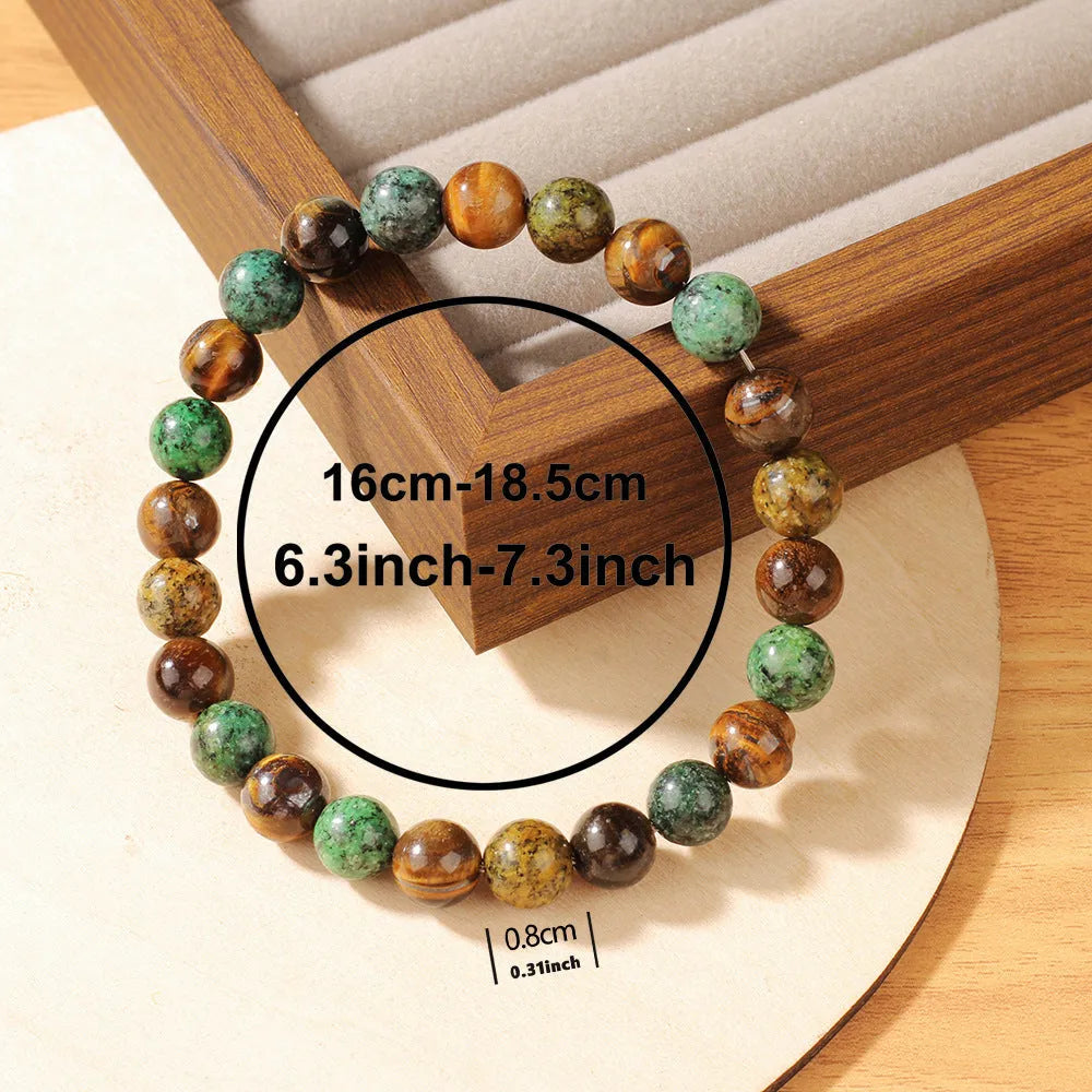 Handmade tigereye stone bracelet with antique floral design and adjustable cord fastening