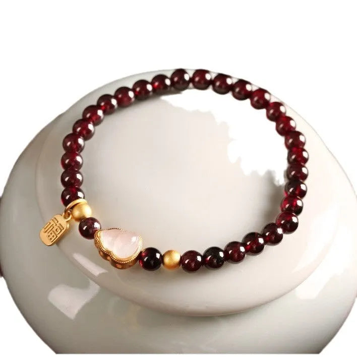 Chinese-style gourd bracelet with imitation garnet beads and Fu character symbols on U-shaped electroplated setting
