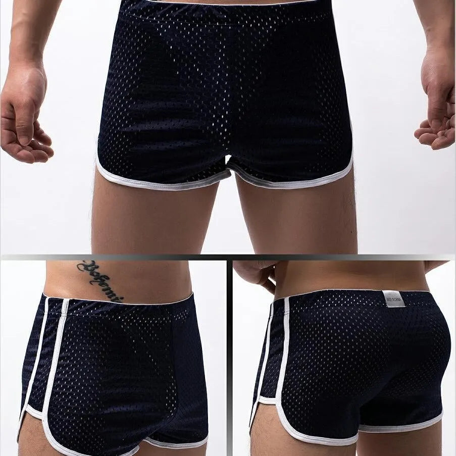 Men's grey three-point boxer shorts with a mid-waistband on a plain background.