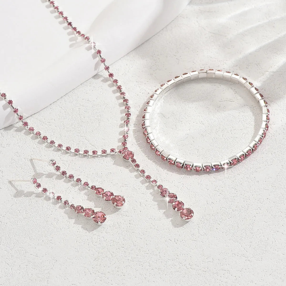 Rhinestone wedding jewellery three-piece set with necklace, bracelet and earrings on snake bone chain
