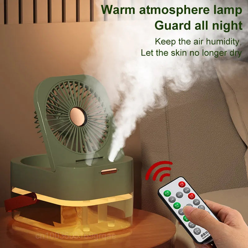 White or green USB desktop humidifier fan with remote control on a wooden desk.