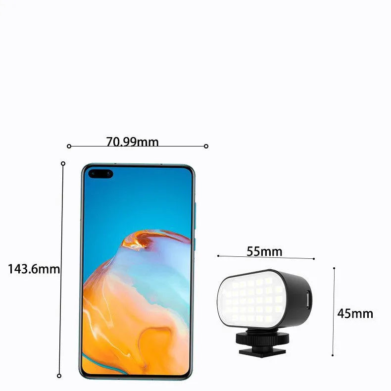 Black ST-30 mobile phone fill light with digital display and cold shoe mount for photography.