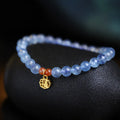 Icy translucent aquamarine crystal bead bracelet with sequin charm and blessing card.
