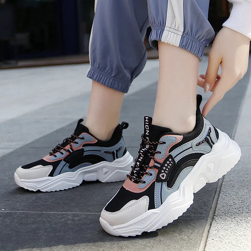 Women's white casual mesh sports shoes with round toe, buckle detail, and a thick PU sole.