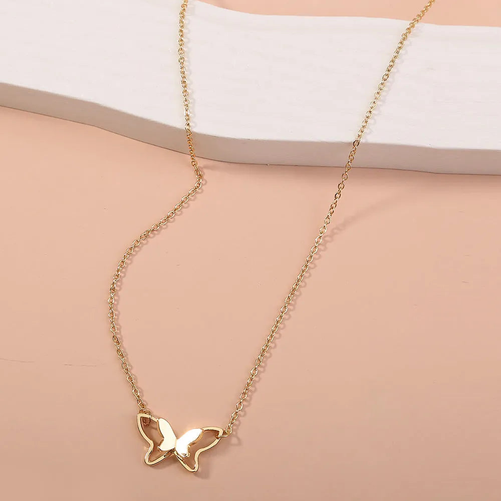 Women's double-layer copper alloy bow pendant necklace on adjustable cross chain