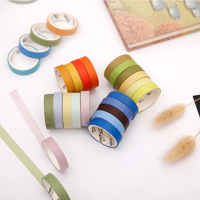 Six rolls of solid colour ledger tape labelled with solar term names, each 9mm wide, on a white background.