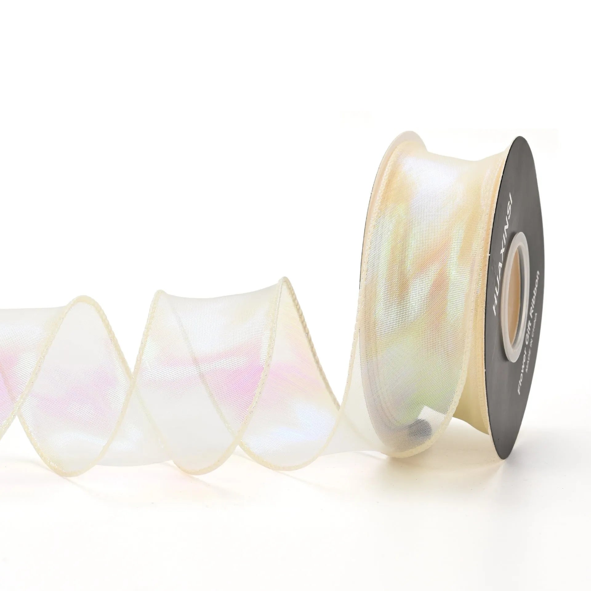 Roll of colourful fishtail yarn mesh ribbon showing its textured, wavy edge, with a colour selection including pink, yellow, and blue.