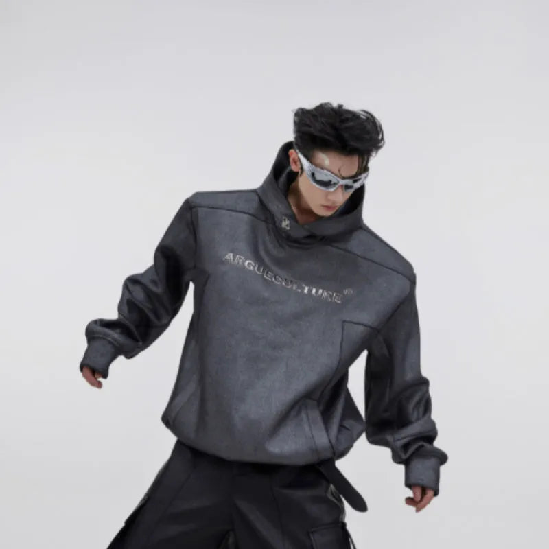 Men's loose grey hooded sweater with heavy shoulder pads and metallic silver geometric print on the chest.