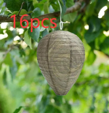 Paper beehive lantern with honeycomb structure, shown in assorted colours, measuring 22cm wide by 28cm high.