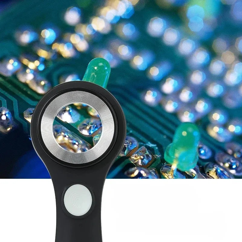 Illuminated black magnifying glass with optical glass lens for jewellery and stamp appraisal on a table.
