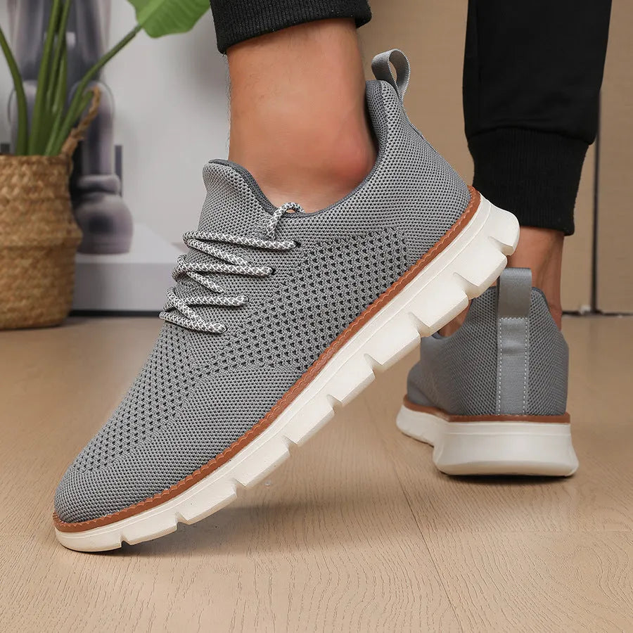 Men's grey and black mesh fabric casual sneakers with low heel and round toe.