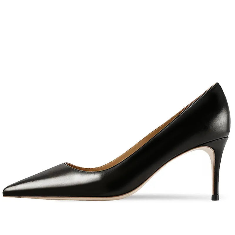 Women's black pointed toe high heel shoes with soft rubber sole on wooden surface
