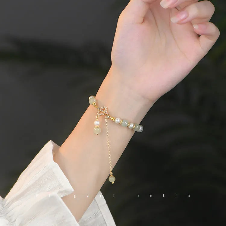 Gold-coloured Hetian jade bracelet with pearl pendant and Chinese style round beads
