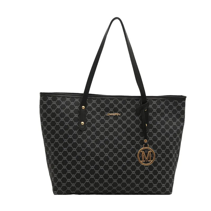 Large black PU leather shoulder bag with sewn thread detailing on a white background.