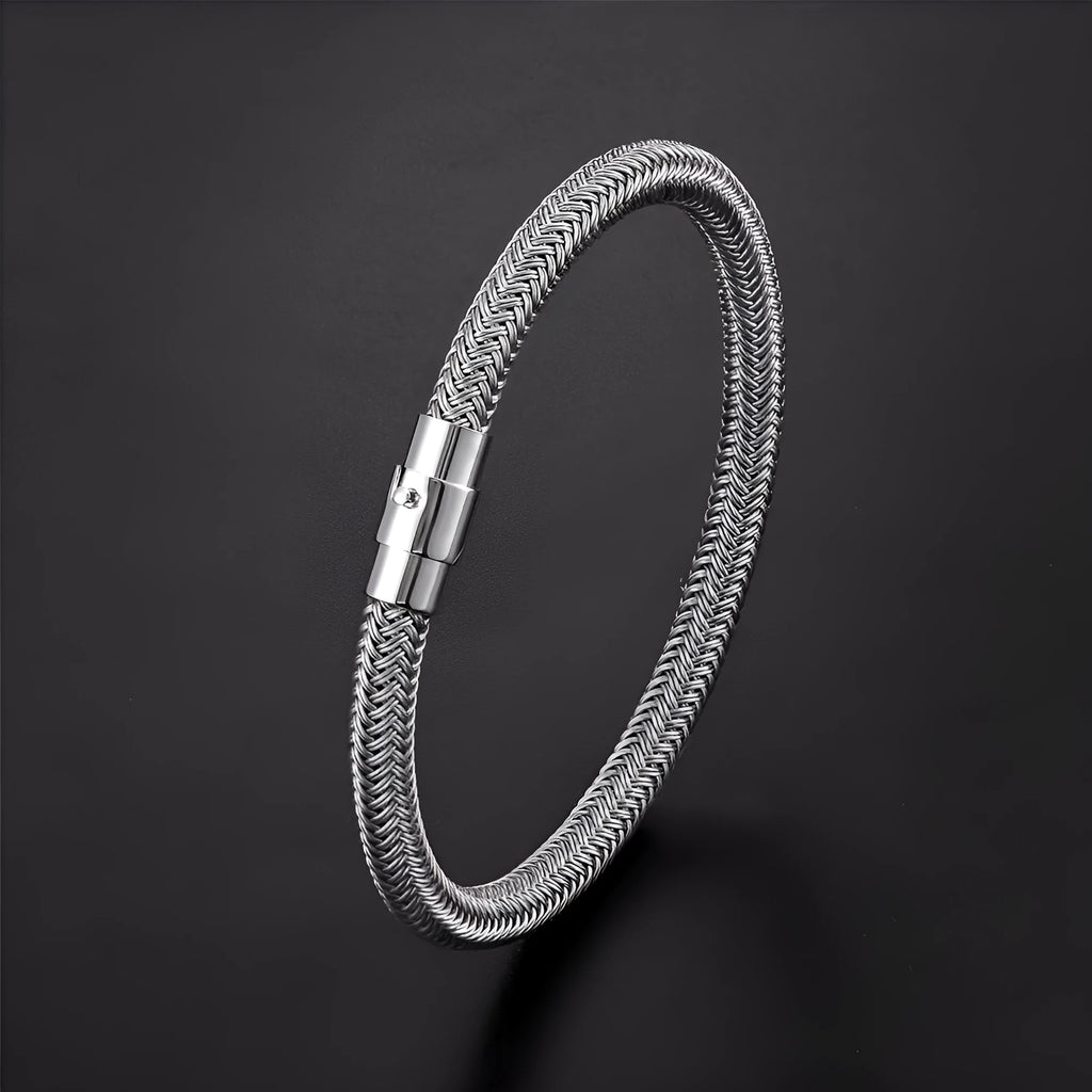 Geometric line design titanium steel bracelet with magnetic clasp on a wrist, showing adjustable sizing.