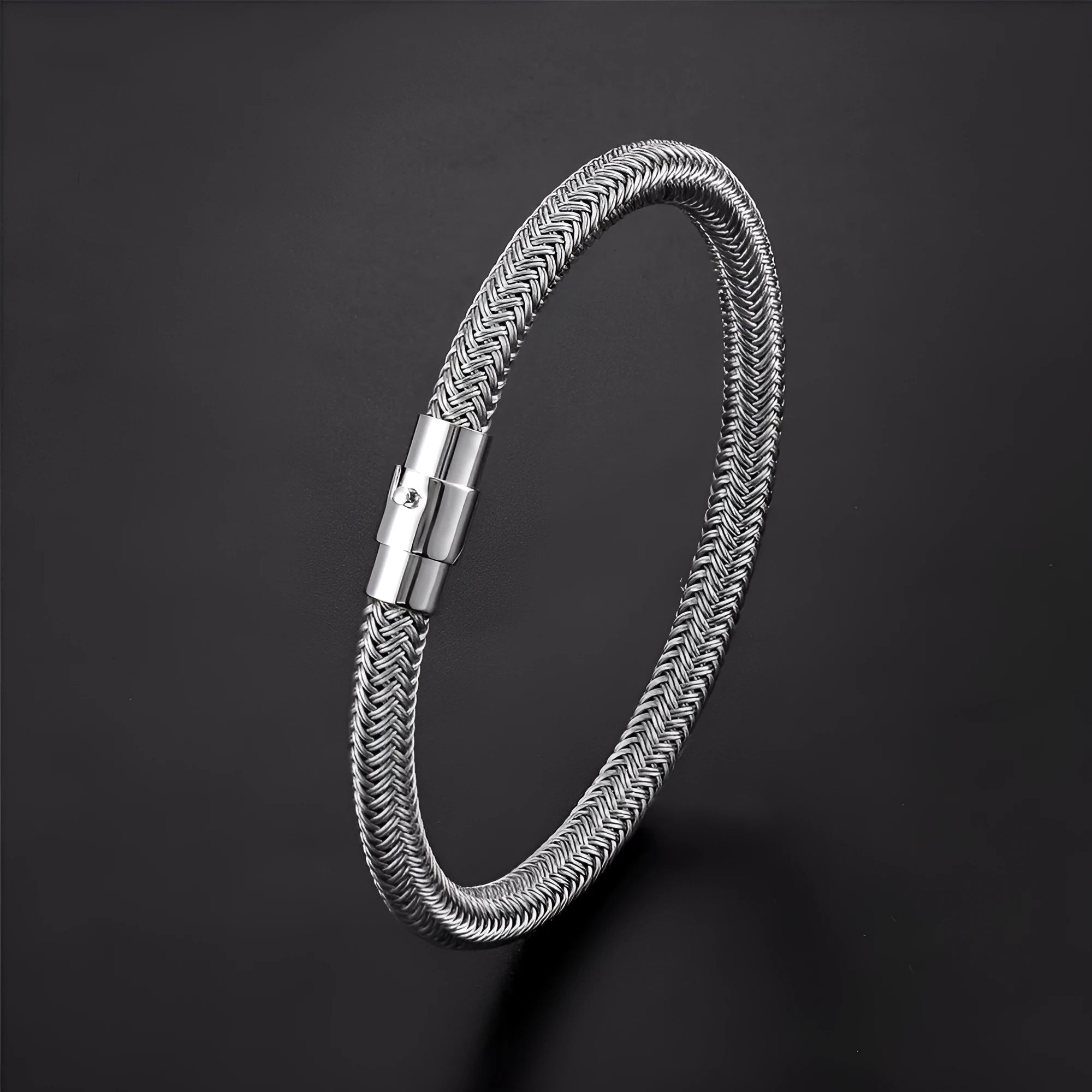Geometric line design titanium steel bracelet with magnetic clasp on a wrist, showing adjustable sizing.