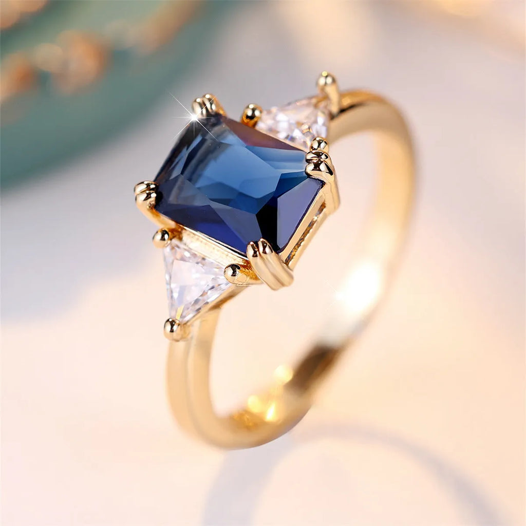 Rectangular gold sapphire blue copper ring for women showing geometric design