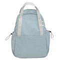 Solid colour nylon backpack with curved shoulder straps shown in five colour options