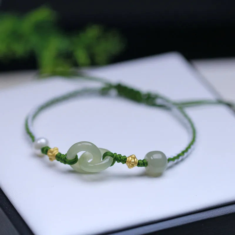 Natural Hetian jade pendant on woven wire bracelet with hollow-out design