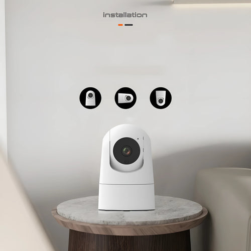 White indoor security camera with wide-angle lens on a shelf, showing compact 80x80x115mm size.
