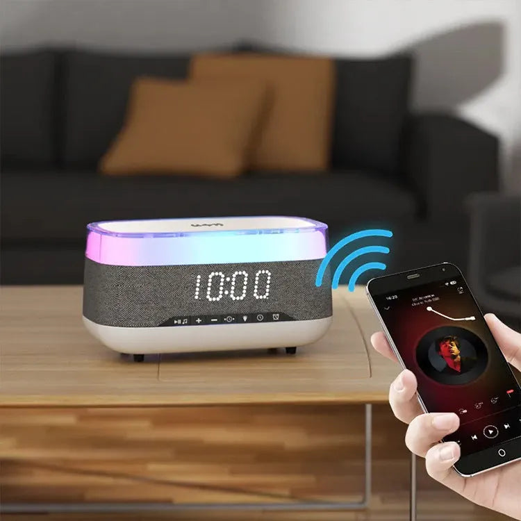 White multifunctional alarm clock with Bluetooth speaker, wireless charging pad, and night light.