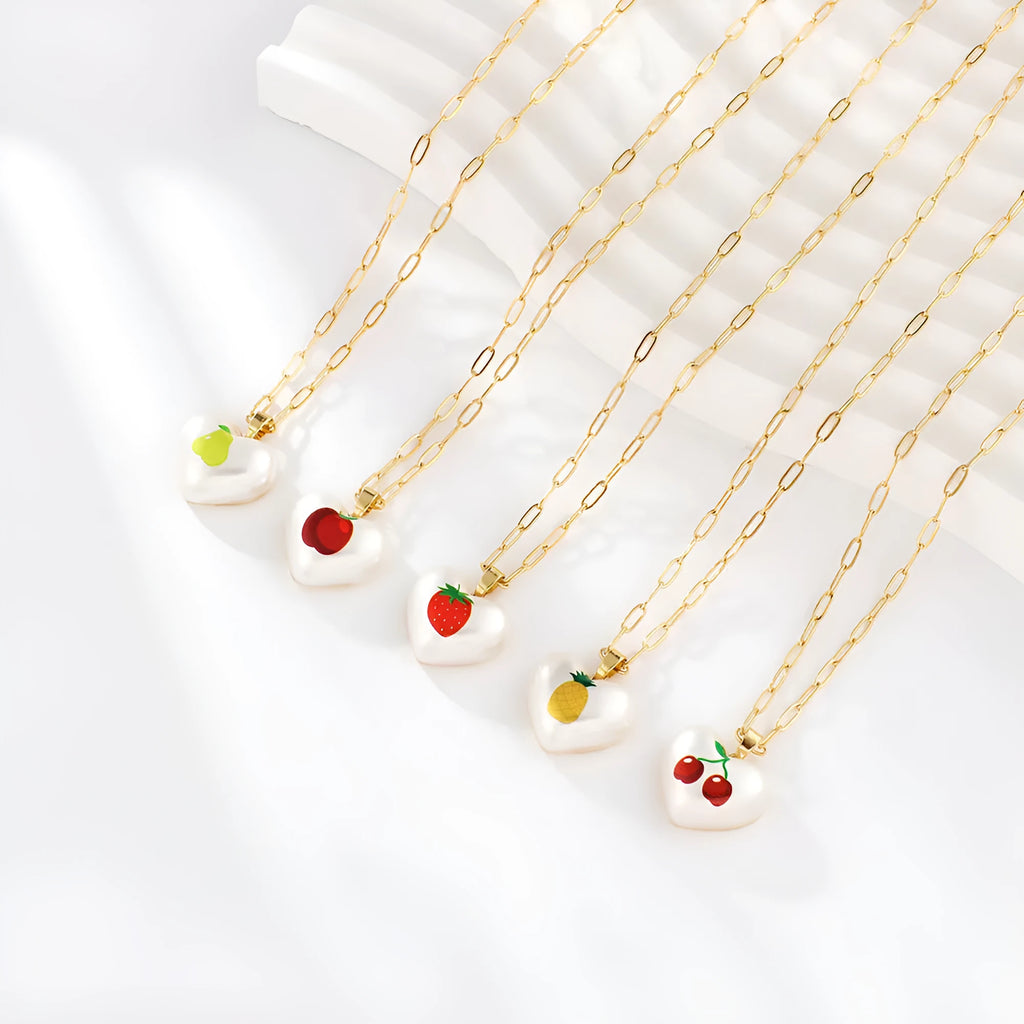 Geometric fruit pendant necklace with adjustable chain showing strawberry pineapple apple pear cherry designs