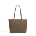 Genuine leather women's tote bag with multiple internal compartments showing document and phone pockets