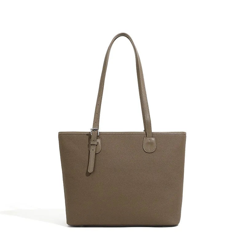 Genuine leather women's tote bag with multiple internal compartments showing document and phone pockets