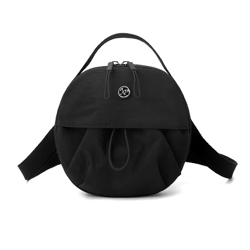 Nylon messenger crossbody bag with out shoulder design showing internal phone and document compartments