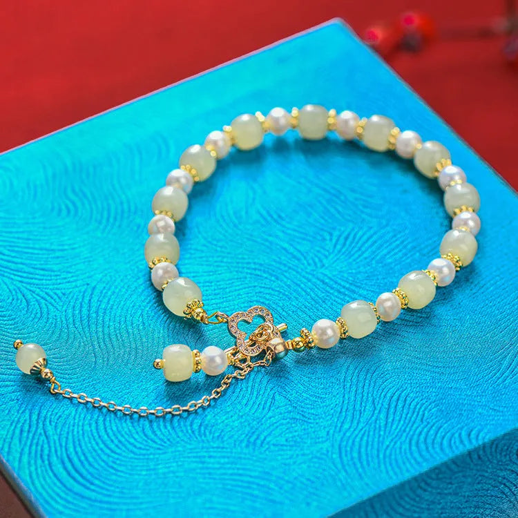 Gold-coloured Hetian jade bracelet with pearl pendant and Chinese style round beads