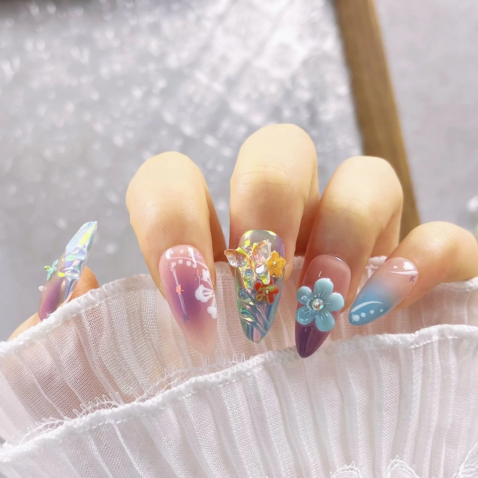 Handmade nail art stickers with colourful floral and butterfly embossed designs