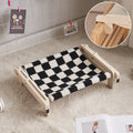 Solid wood cat bed with removable fabric in black and white plaid pattern