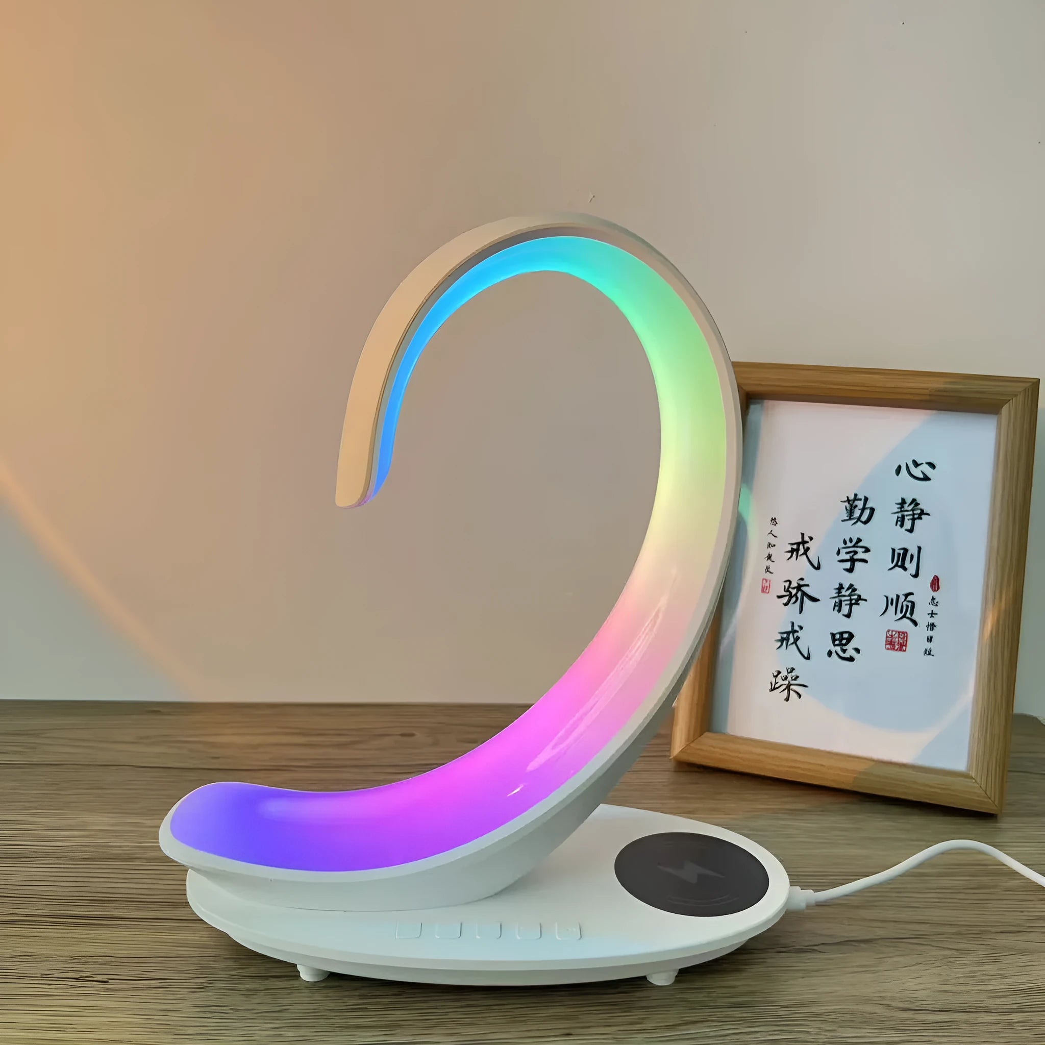 White swan-shaped desk lamp with colourful LEDs, integrated wireless charger, and Bluetooth speaker.