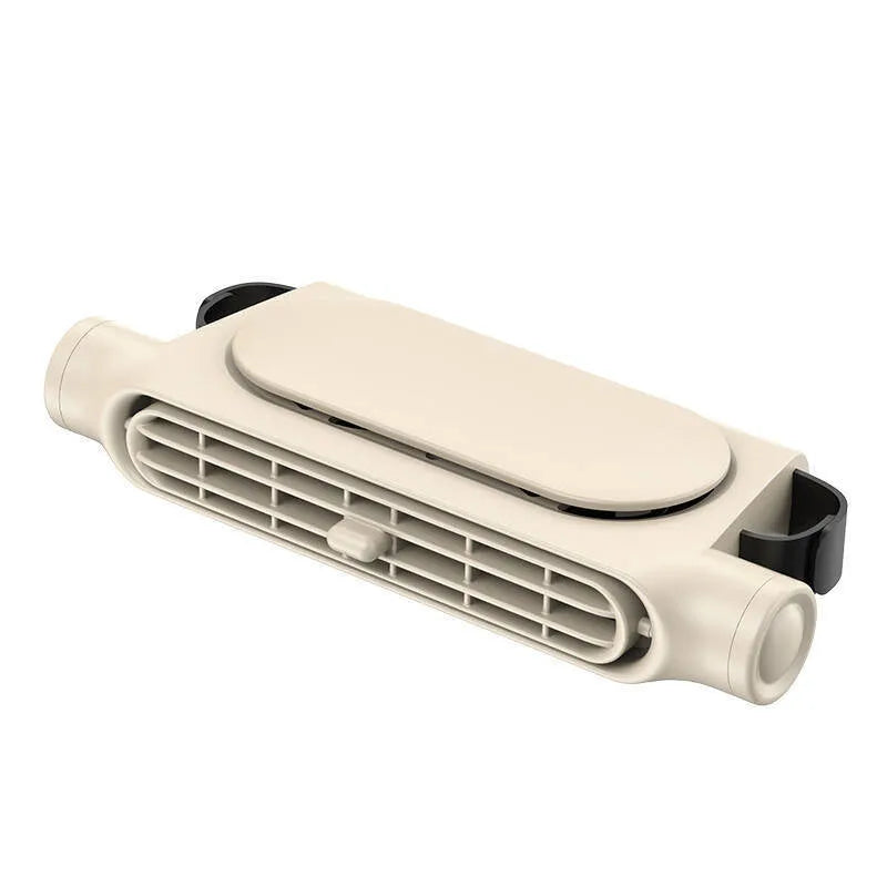 Beige bladeless USB car fan with Velcro mount attached to a car headrest