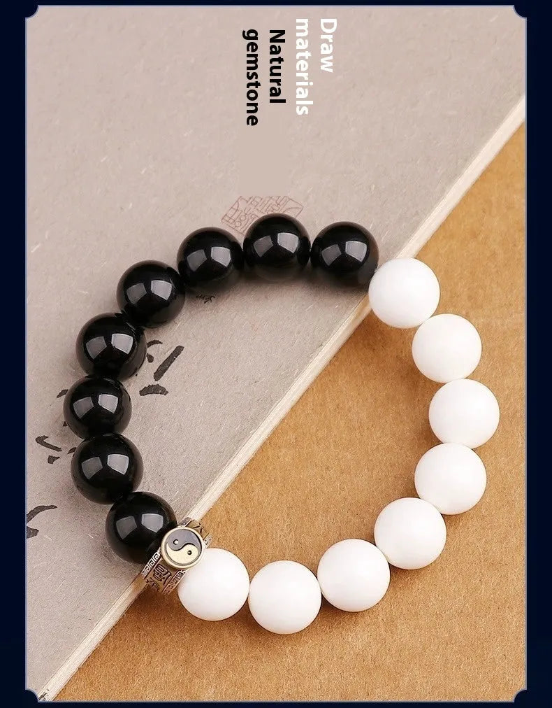 Black and white Tai Chi bracelet with obsidian beads and mantra charm