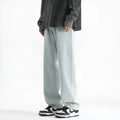 Men's light blue straight leg jeans with button waist on a mannequin.