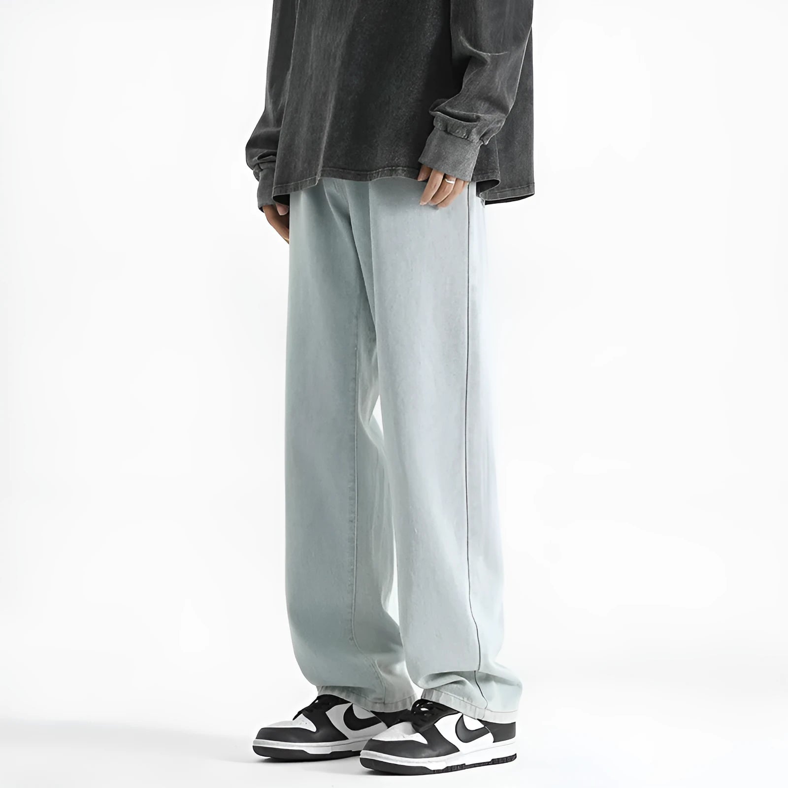 Men's light blue straight leg jeans with button waist on a mannequin.