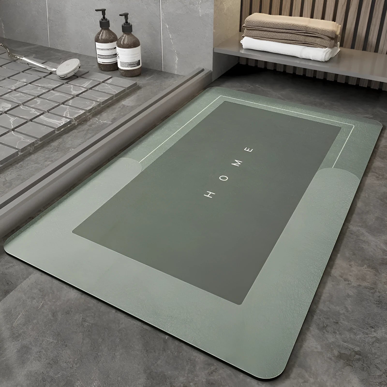 Machine-woven rectangular blue floor mat placed on a bathroom floor.