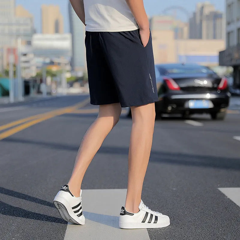 Men's grey cotton quick-drying five-point sports shorts with elastic waistband, front view
