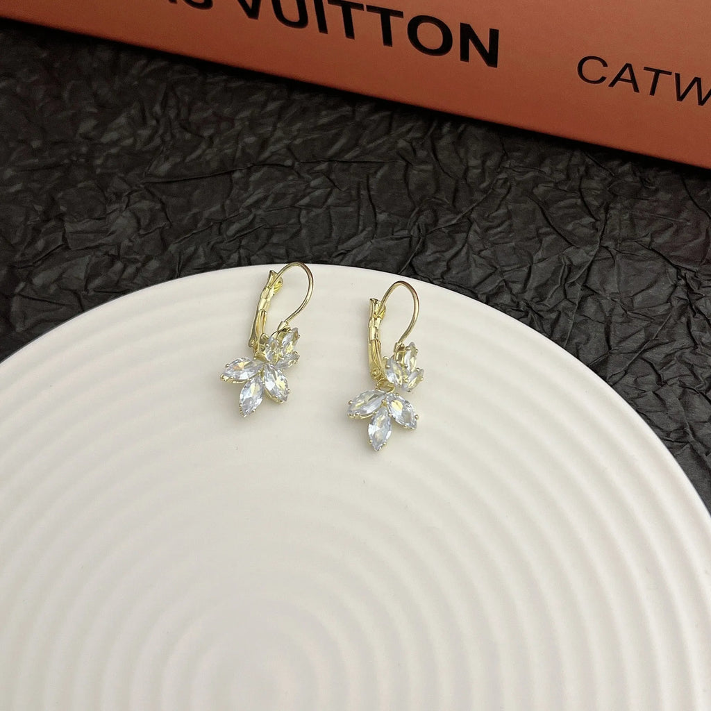 Platinum colour leaf-shaped earrings with inlaid zircon stones