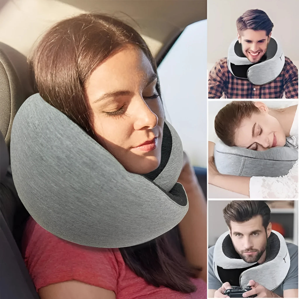 Navy blue U-shaped travel neck pillow rolled up next to its carry bag