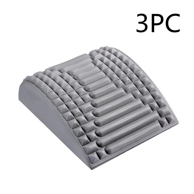 Blue back stretcher pillow for lumbar and neck support on a grey background.