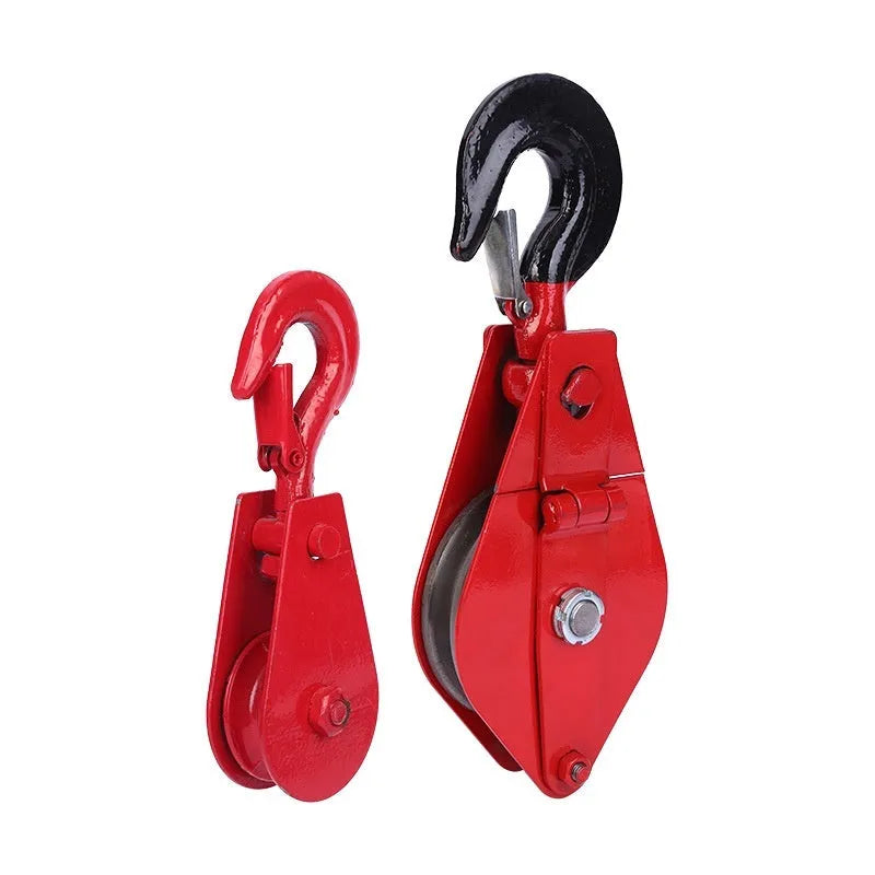 Red industrial steel lifting pulley with a safety latch on the hook for secure lifting.