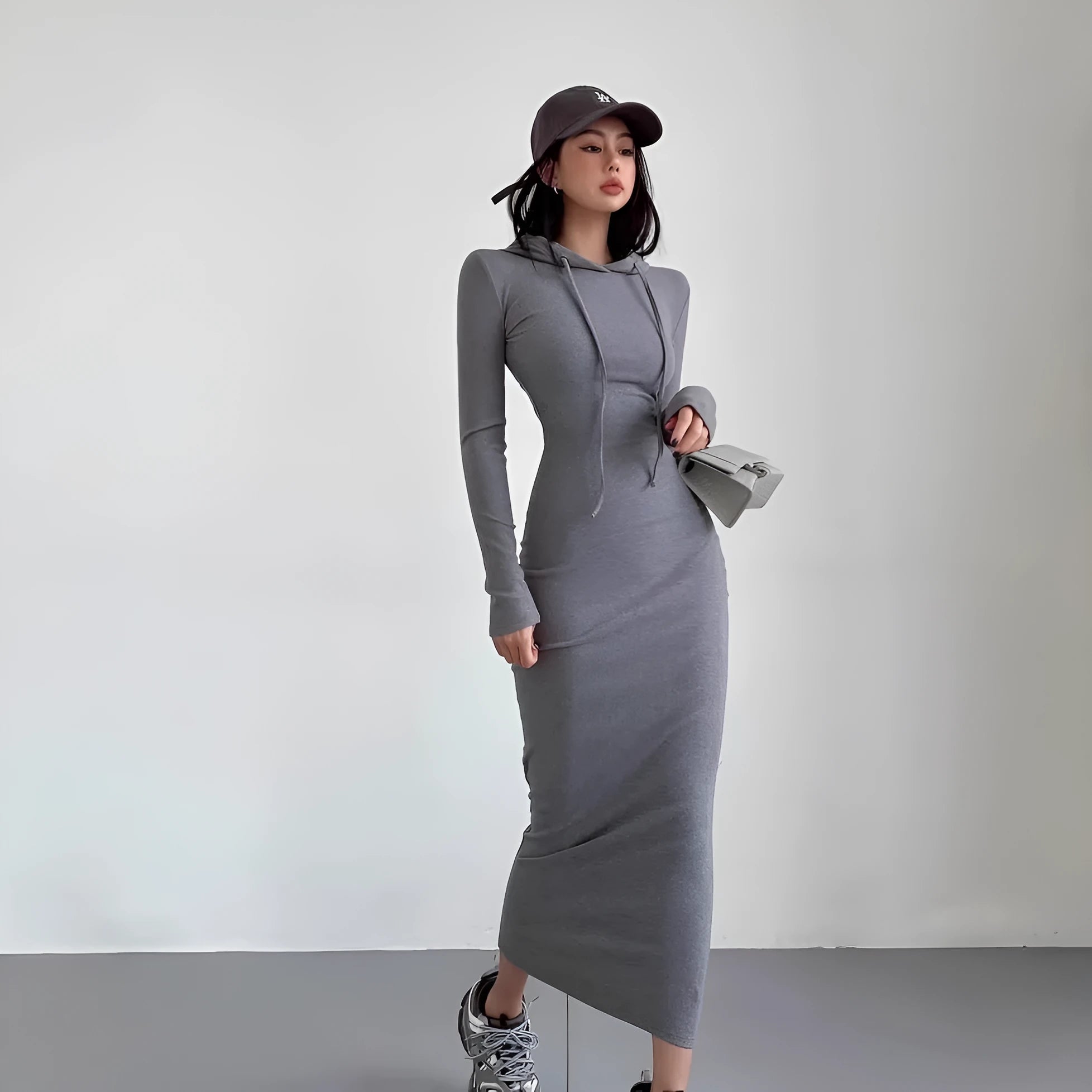 Women's long sleeve hooded sheath dress in light grey, a pullover style with a high waist.