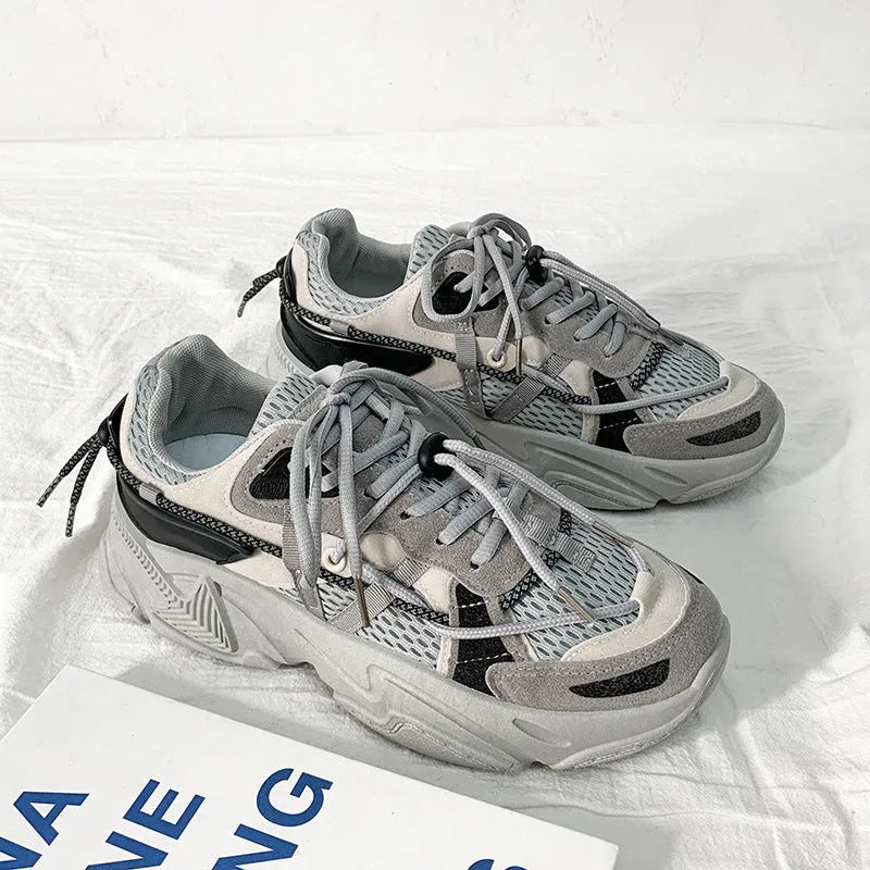 Men's white Korean-style platform dad sneakers with lace-up front and breathable mesh lining.