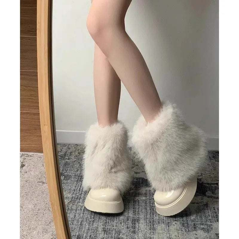 Women's black artificial plush snow boots with a waterproof rubber sole and fleece lining.