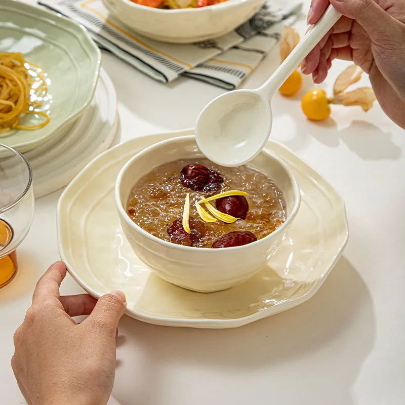 Solid colour ceramic dinnerware set with plates and bowls in modern Japanese minimalist style.