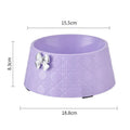 Diamond pattern pet feeding bowl with a bowknot decoration in black, purple or white with a pink or silver bow.