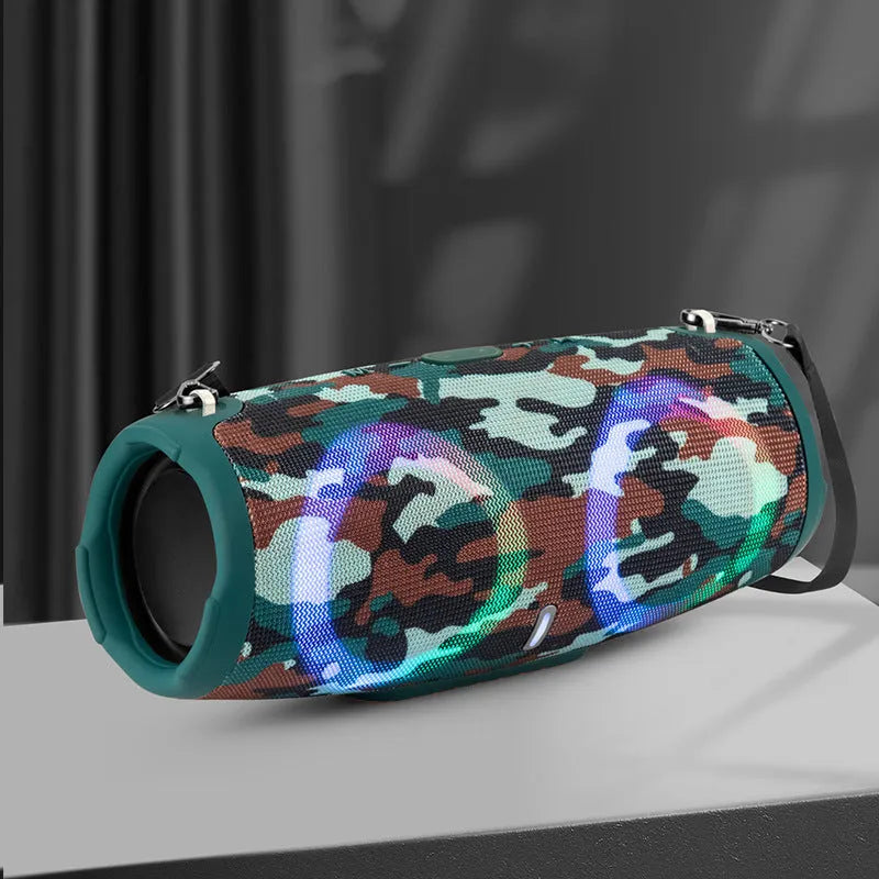Cylindrical War Drum Bluetooth speaker with coloured RGB lights in a waterproof outdoor setting.