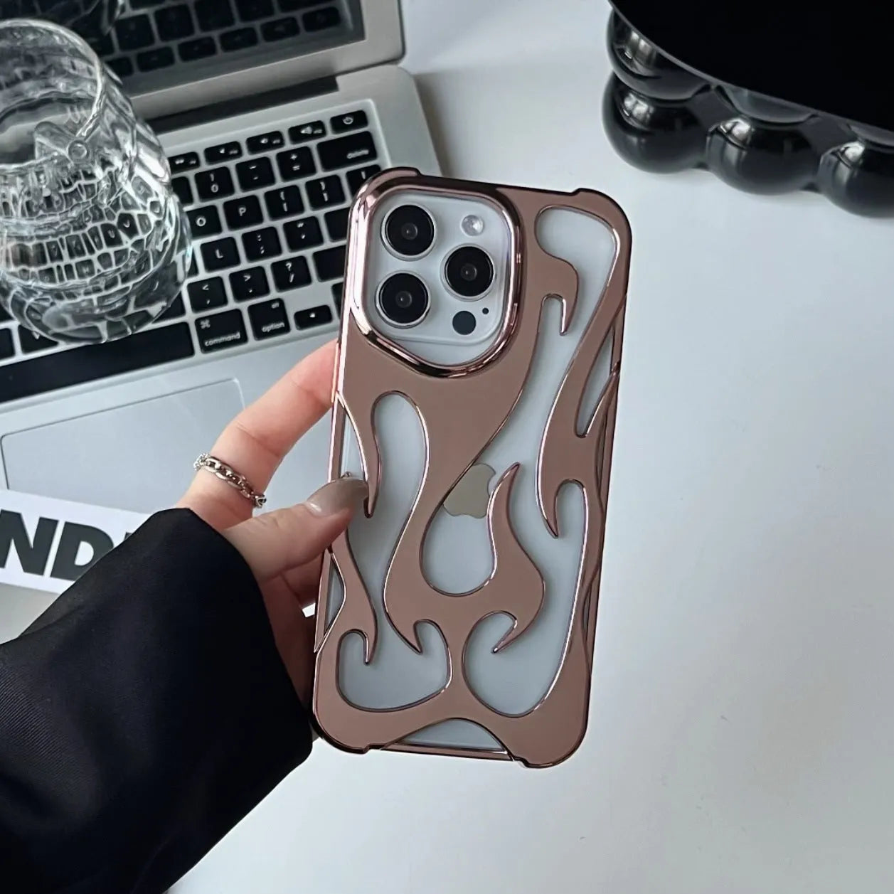 Electroplated hollow flame pattern soft TPU phone case for Apple iPhone, shown in silver on a dark background.